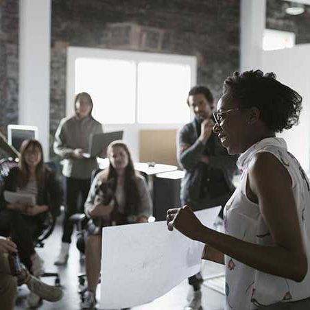 Employees gathering for a business presentation 